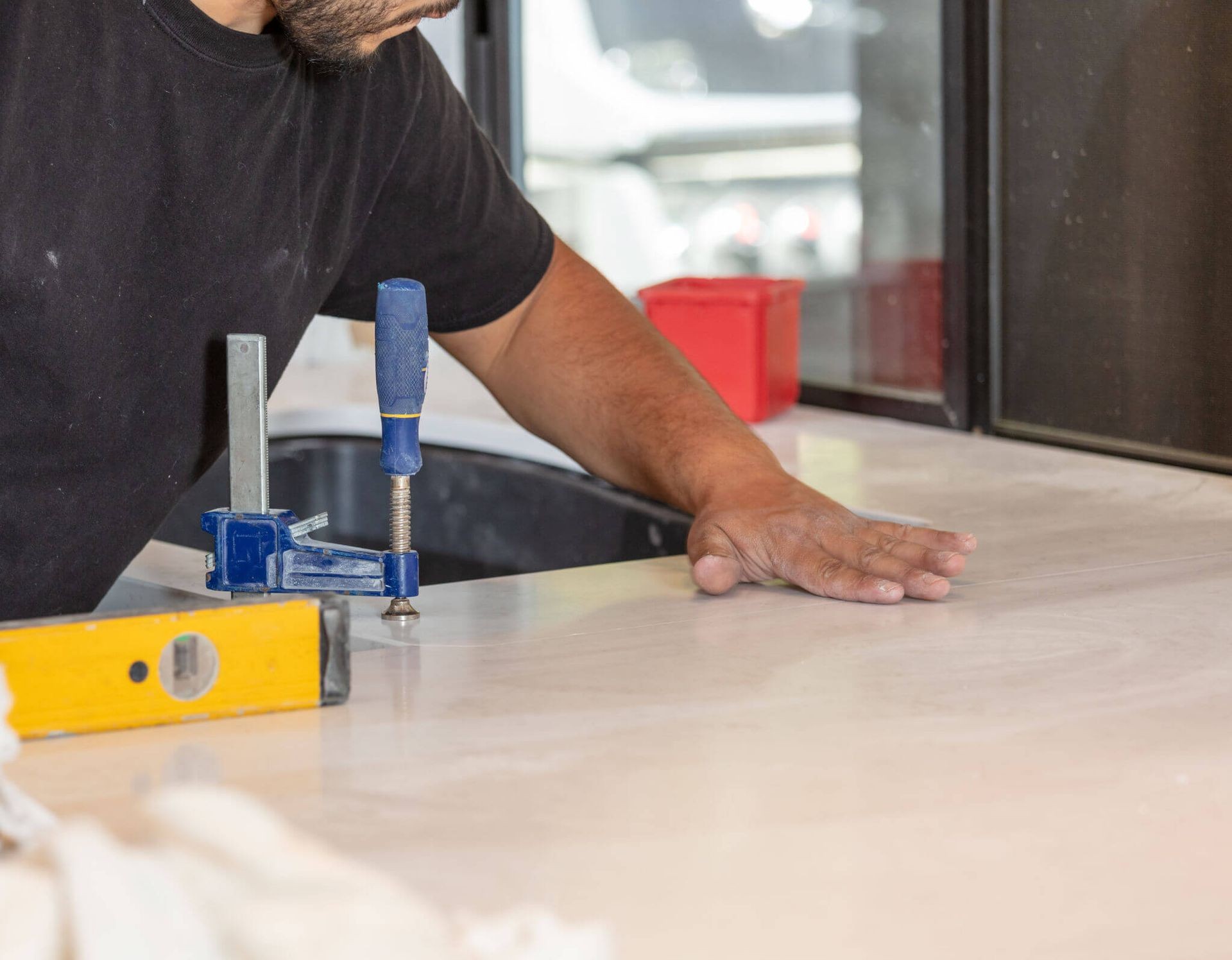 Man installing a stone countertop